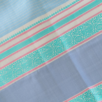 Closer view of the border showing teal Yaali motifs.