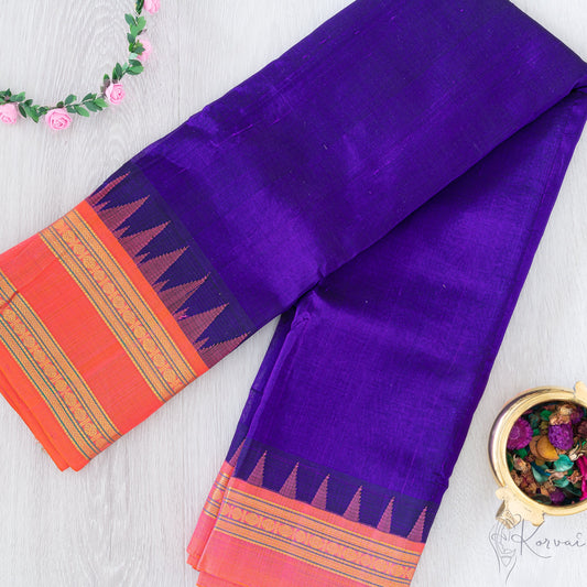 Blue silk cotton saree with orange border and orange temple korvai motifs.