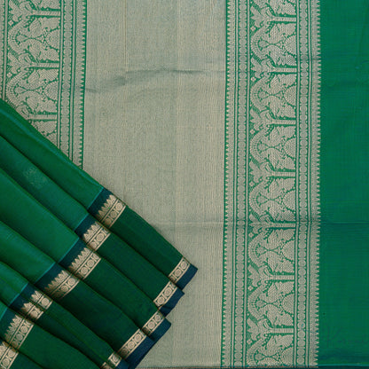 Bottle green silk cotton saree with closer view of Bottle green pallu that has intricate gold zari work.