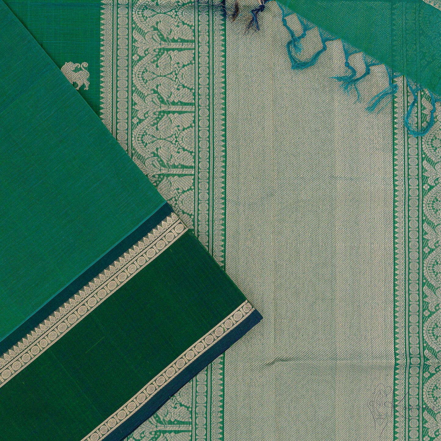 Bottle green silk cotton saree with closer view of Bottle green pallu that has intricate gold zari work.