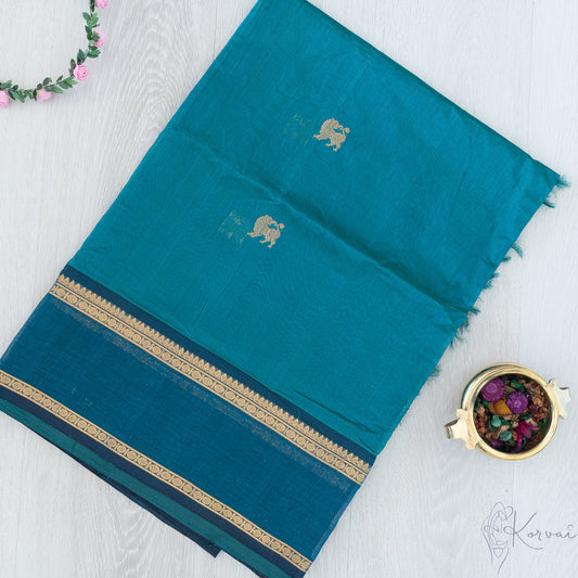 Blue silk cotton saree with double border and yaali motifs.