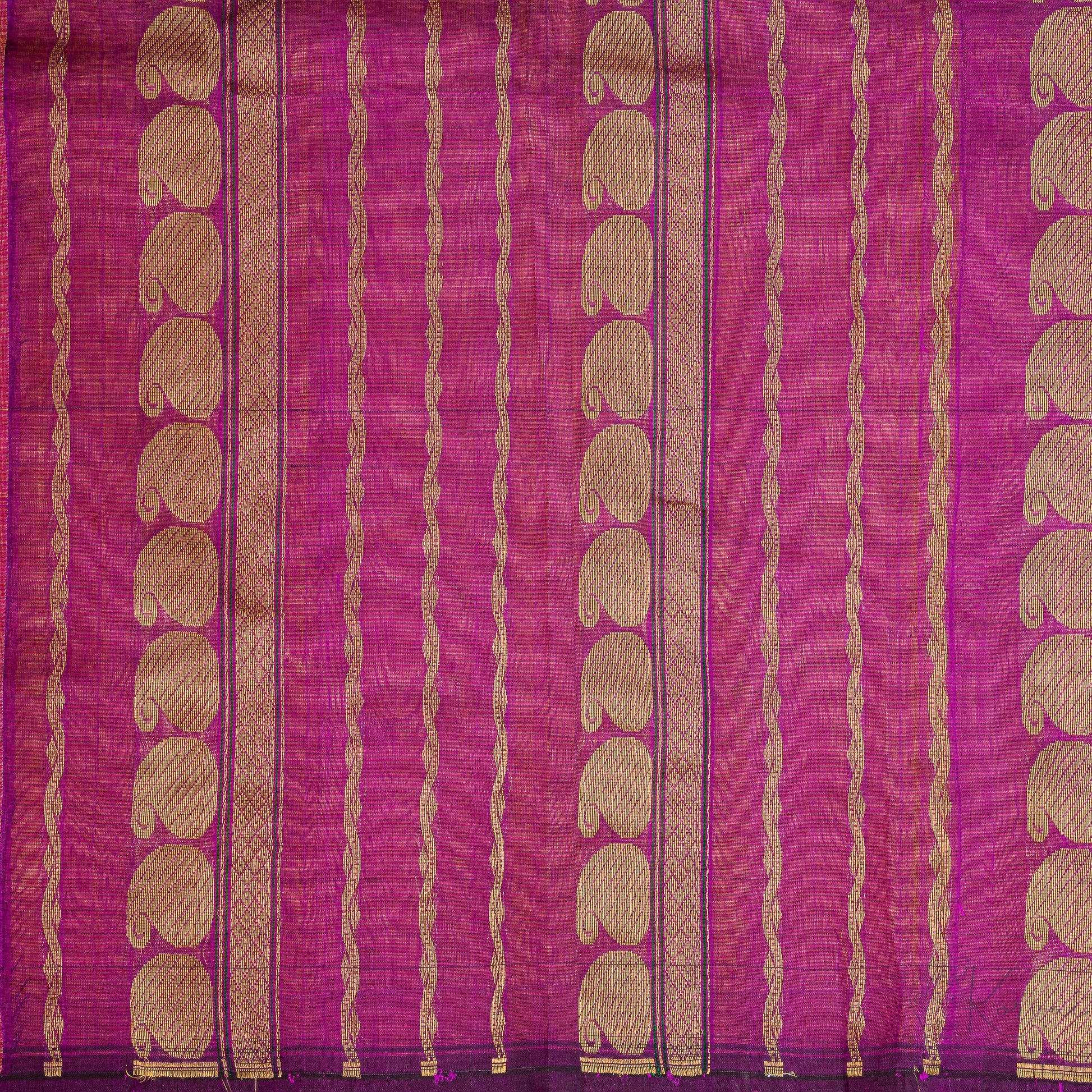 closer view of purple pallu that has intricate gold zari work.