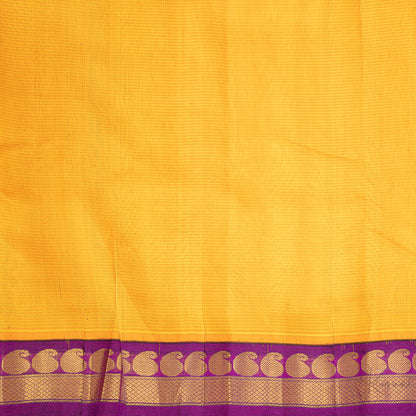 Closer iew of yellow silk cotton body with purple border that has mango motifs.