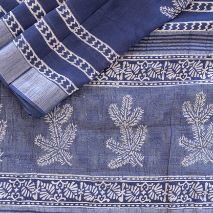 Blue cotton saree with white block printed motifs.