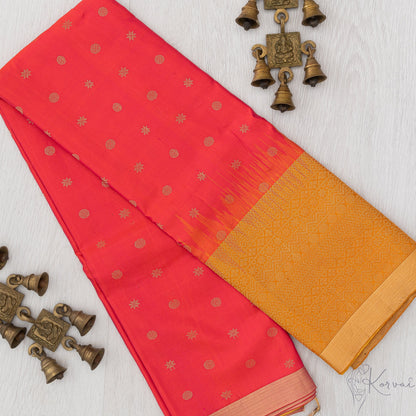 Pinkish red Kanjivaram soft silk saree with mustard border.