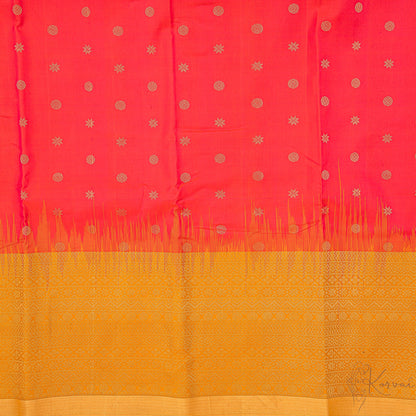 Closer view of pinkish red body with circle and star motifs and mustard pallu.